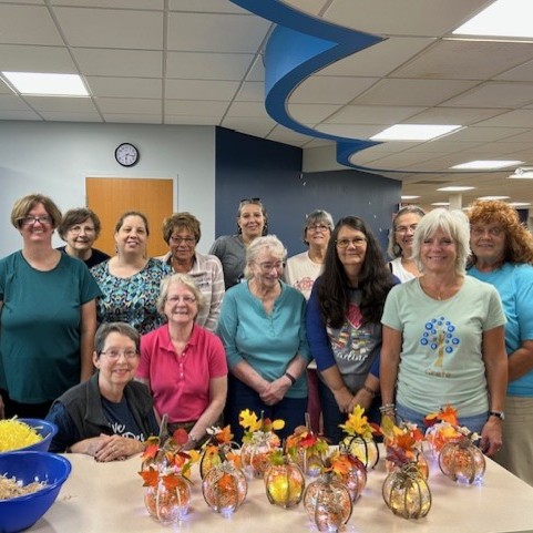 Group of women smiling at a library program